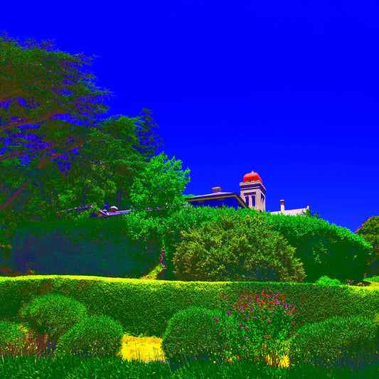 Vivid Country - Daylesford The Convent - 3828v33 - Close Detail View, a bold landscape of vivid greens and electric blue sky frames the iconic domed tower of The Convent in Daylesford, surrounded by manicured hedges and lush foliage.