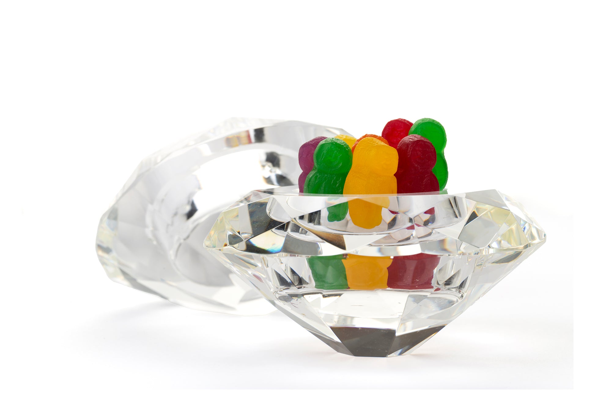 Diamonds Are 1643 - 104x74cm, colourful jelly baby figures standing upright in a large faceted crystal bowl shaped like a diamond, with a second gem behind, fine art photograph by Raymond Mather, ART1.