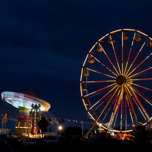 Fairground Carnival Lights 6900003v3 - Close Detail View, Ferris wheel glowing against twilight sky with carnival rides below, fine art limited edition print by Raymond Mather, ART1.