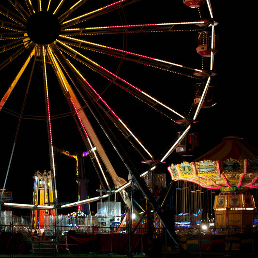 Fairground Carnival Lights 6900003v3 - Close Detail View, Ferris wheel glowing against twilight sky with carnival rides below, fine art limited edition print by Raymond Mather, ART1.