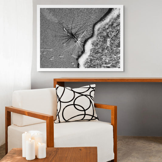 Monochrome Mix - Beach - Spinifex - 184008 - Room View, A black and white photograph of a spinifex plant on wet sand, with ocean foam encroaching from the right. Dynamic textures meet soft shadows. Limited edition fine art print.