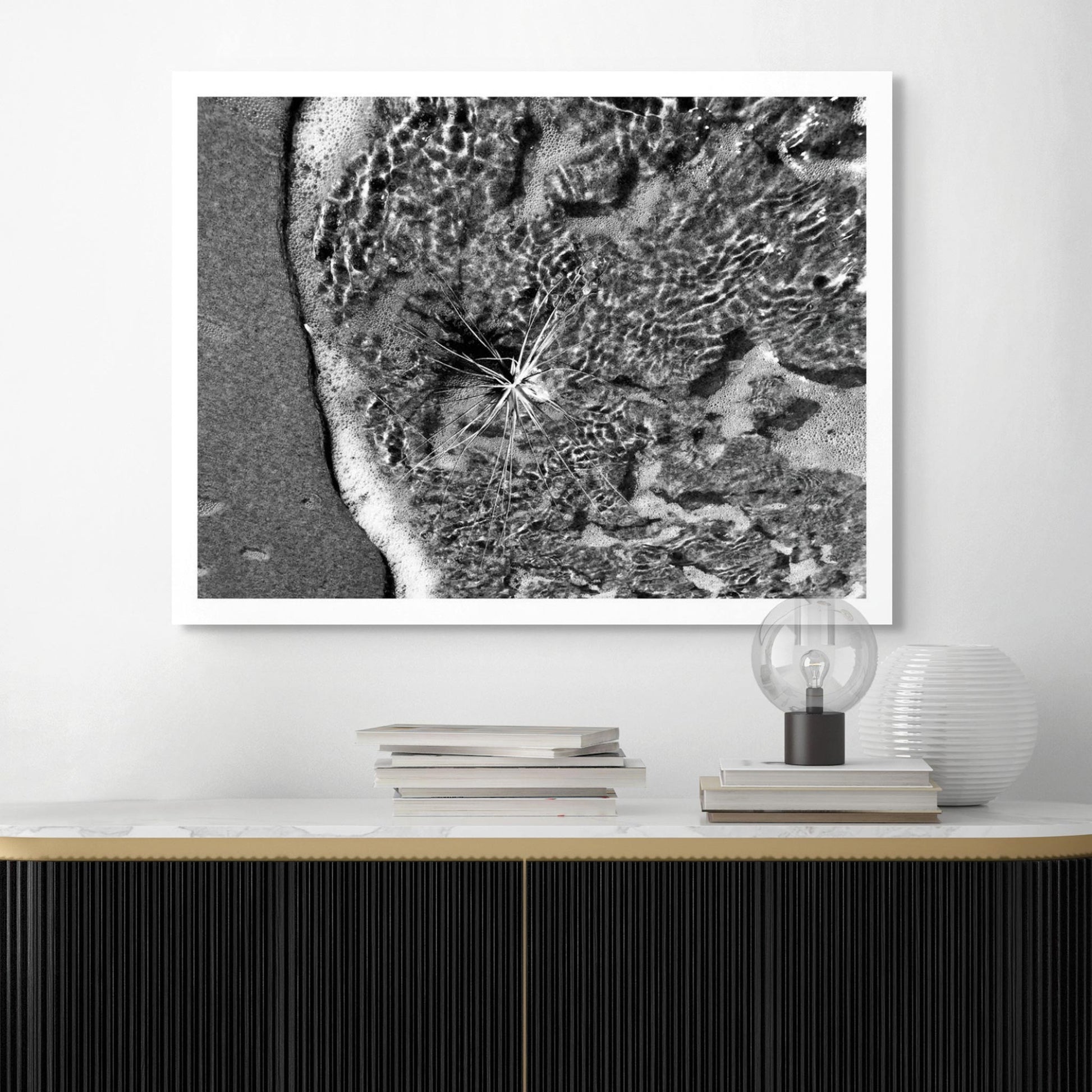 Monochrome Mix - Beach - Spinifex - 184009 - Room View, A black and white photograph of spinifex surrounded by lapping seawater and foamy surf, with striking ripple patterns and fine detail. Limited edition fine art print.