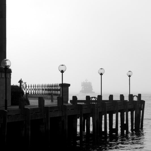 Monochrome Mix - Ferry in the Mist - 1720675 - Close Detail View, A ferry appears through heavy mist beyond a quiet dock with vintage lamp posts, rendered in soft black and white. Moody, atmospheric waterscape Sydney Harbour. Limited edition fine art print.