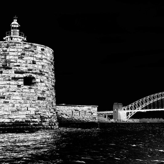 Monochrome Mix - Sydney - Fort Denison - Pinchgut Island - 209617v22a - Close Detail View, Black and white photo of Fort Denison in Sydney Harbour with the Harbour Bridge in the background; high contrast night sky and rippling water in the foreground.