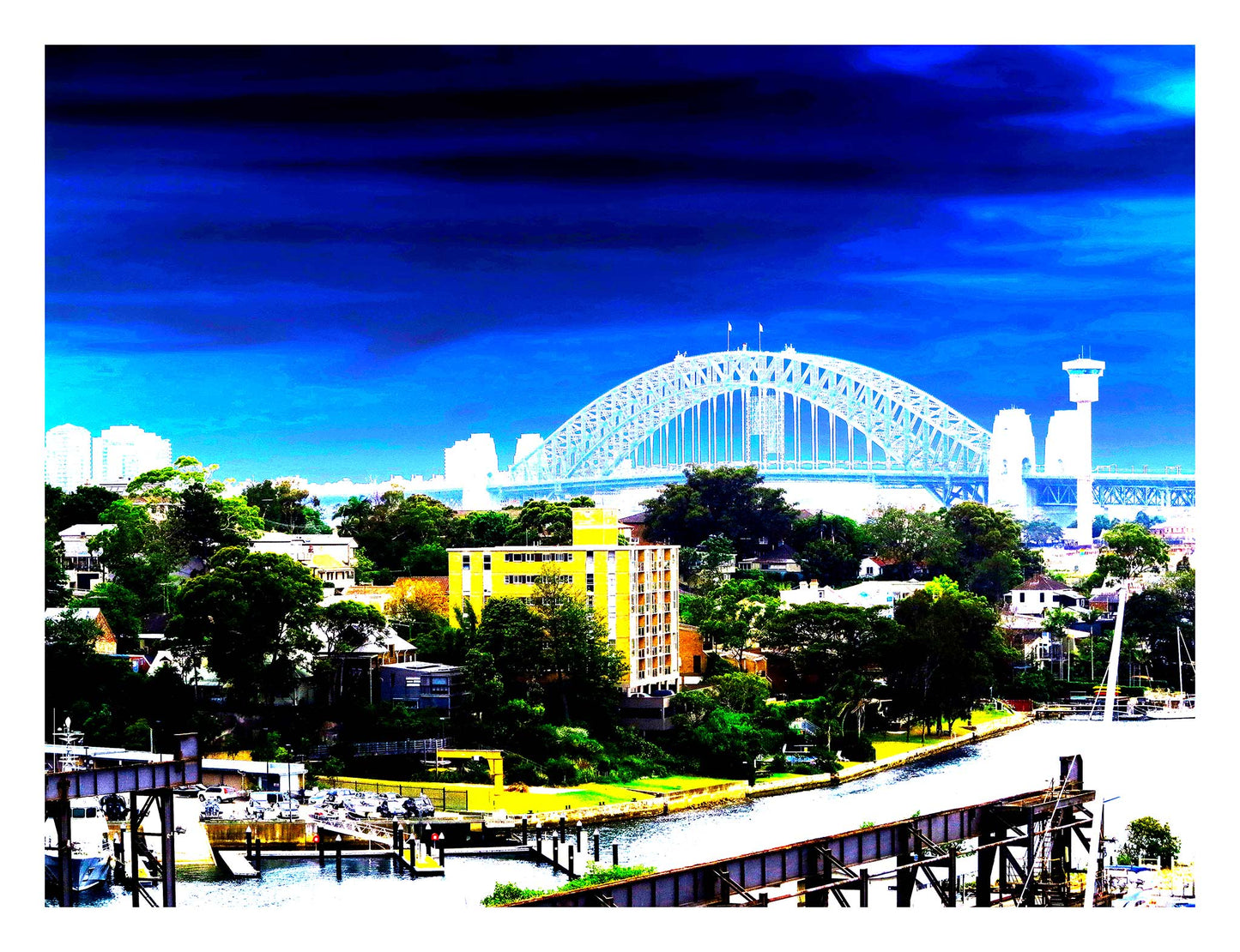 POPscape Sydney - Harbour Bridge View - 190022v89 - 104x81.5cm, Vibrant stylised view of Sydney Harbour Bridge with saturated blue sky, suburban rooftops, and a bold yellow building in the foreground overlooking the water.
