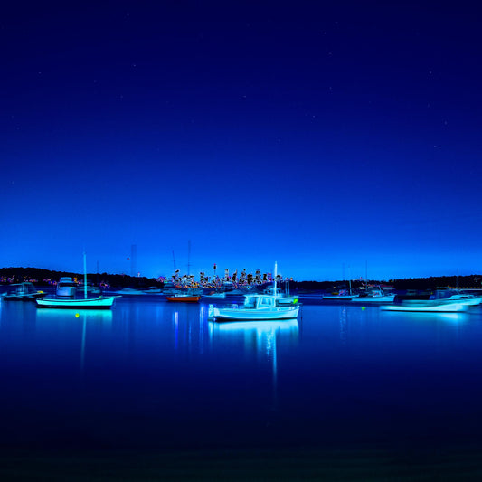 POPscape Sydney - Watsons Bay - Boats Night - 100970v2b3 - Close Detail View, Stylised night photograph of illuminated boats floating in Watsons Bay, Sydney. Deep blue tones and glowing highlights reflect on calm water under a star-speckled sky. Pop Art-style treatment with dreamlike vibrancy.