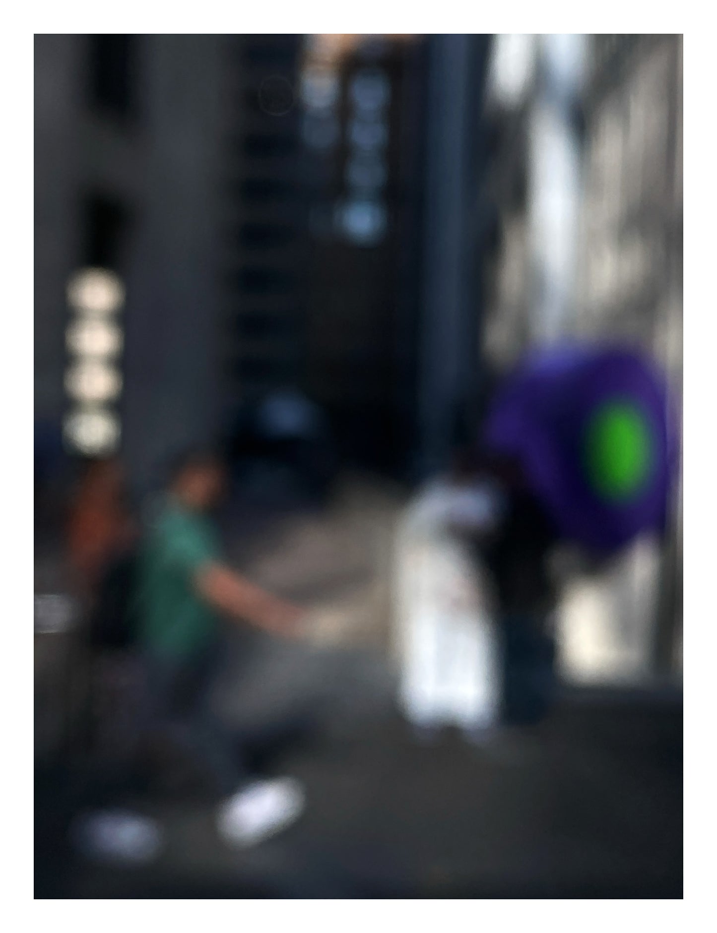Urban Commute - Series No.1: 0960v1 - 81.5x104cm, a soft-focus image of a city commuter mid-stride beside a vivid purple umbrella, set between tall buildings in gentle light. An abstracted urban moment captured in motion. Limited edition fine art print by Raymond Mather.