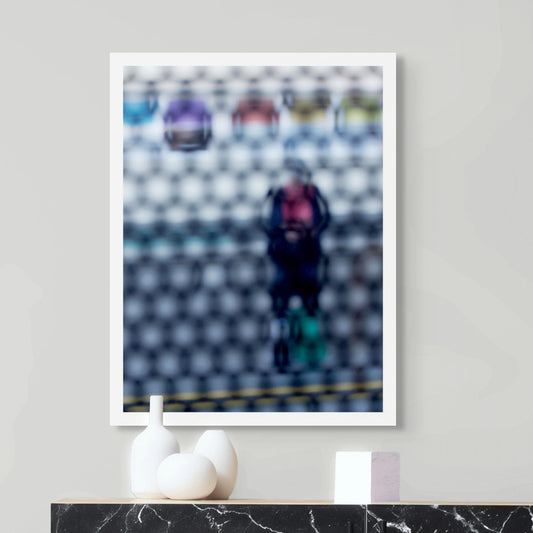 Urban Commute - Series No.2: 9153 - Room View, fine art photograph by Raymond Mather showing a blurred figure in red and navy with a backpack and helmet, standing before a row of colourful train seats. Seen through a circular grid, the image evokes themes of pause, movement, and visual abstraction.